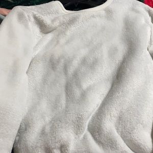 A white sweater kinda thin material